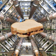 A sandwich edited onto an image of the LHC from 2008.